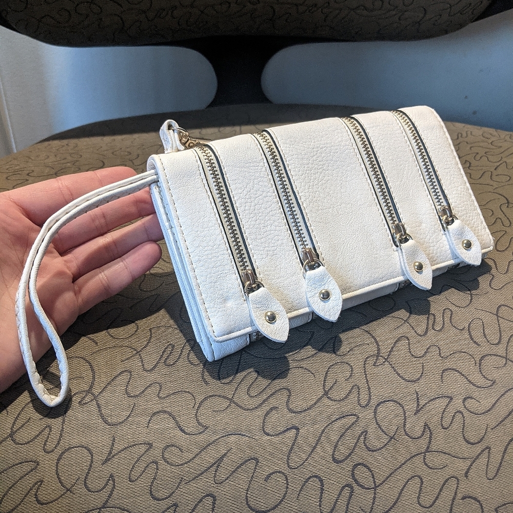 White faux leather clutch with functional zipper accents
